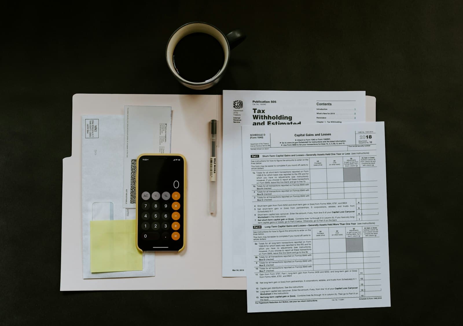 Restaurant cost structure: receipts, ledgers, and a calculator on a counter