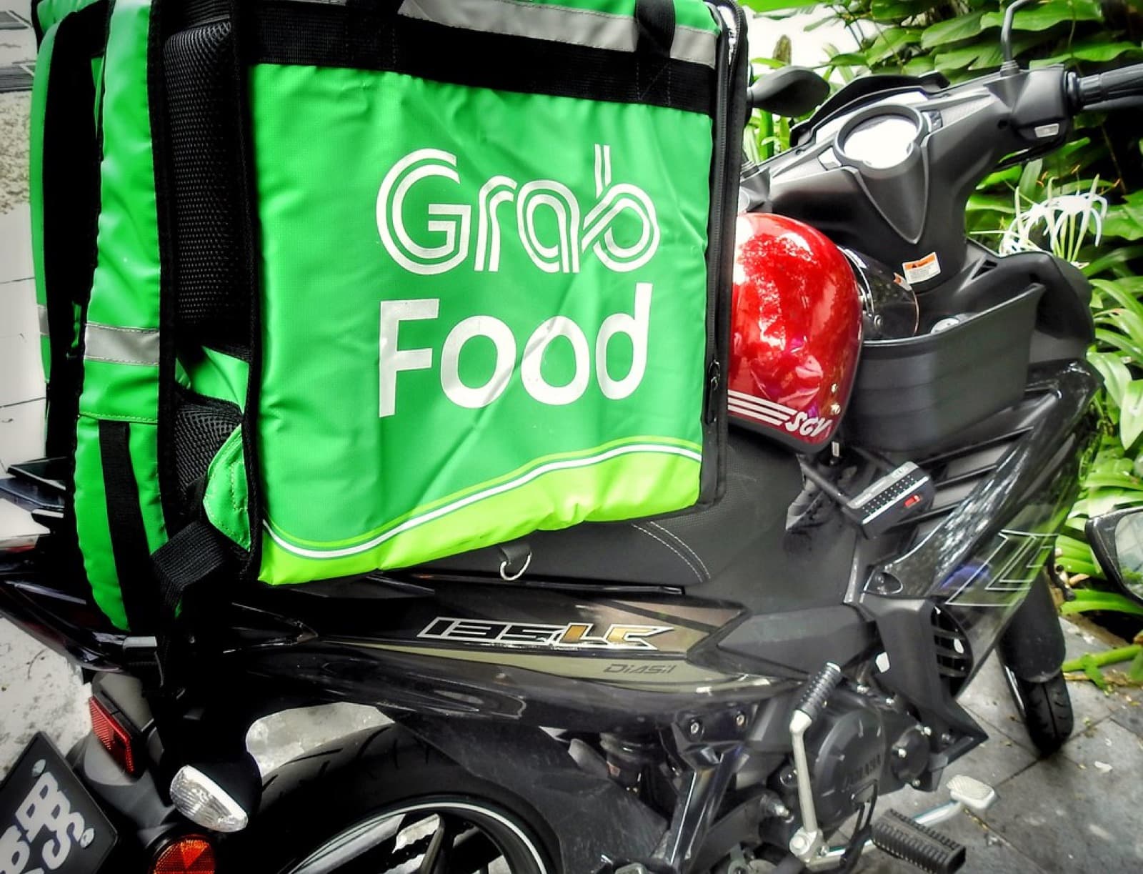 A food delivery motorbike with an insulated courier box