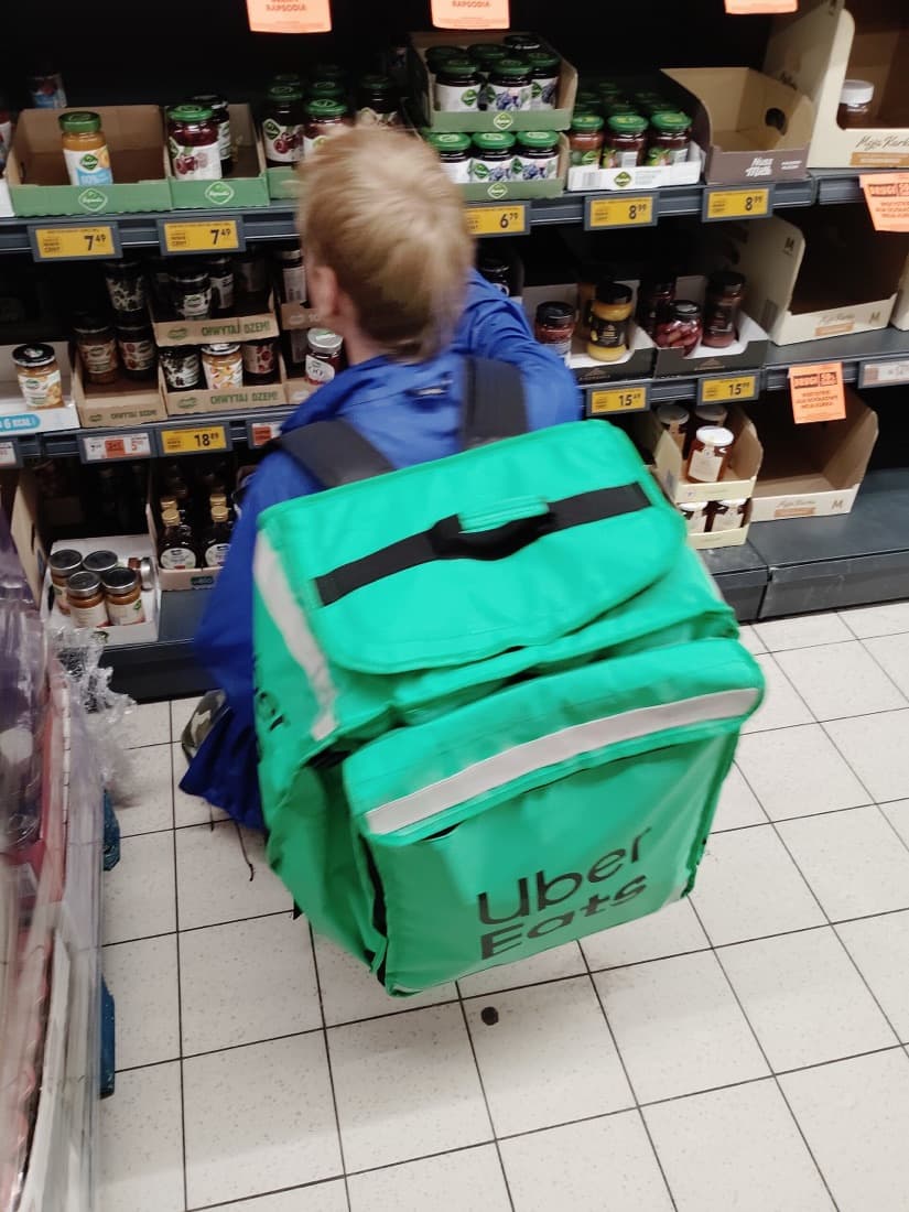 An Uber Eats courier picking up an order