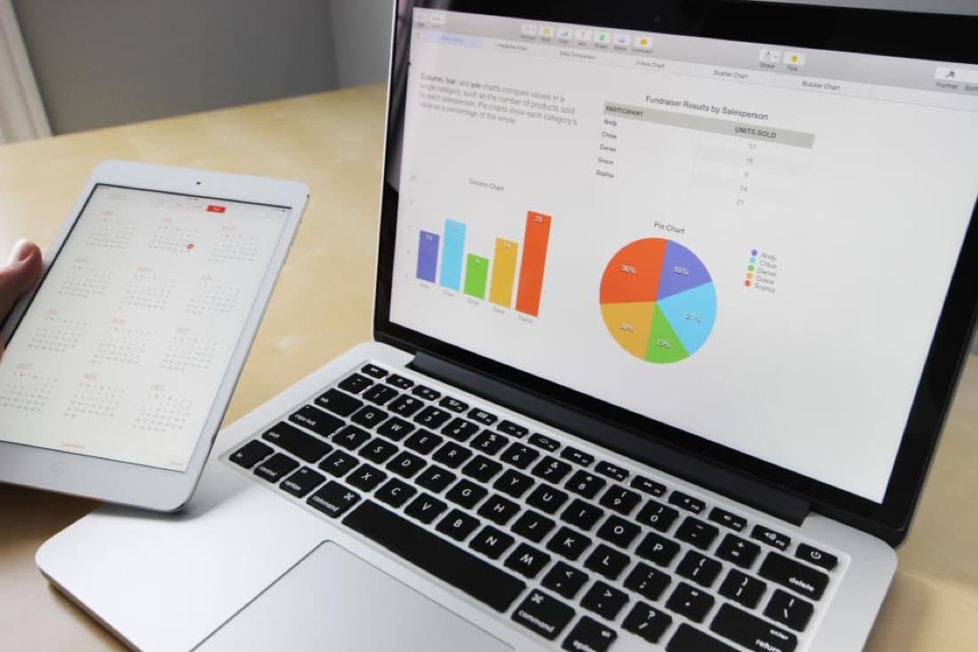 Comparing platforms on a laptop with notes