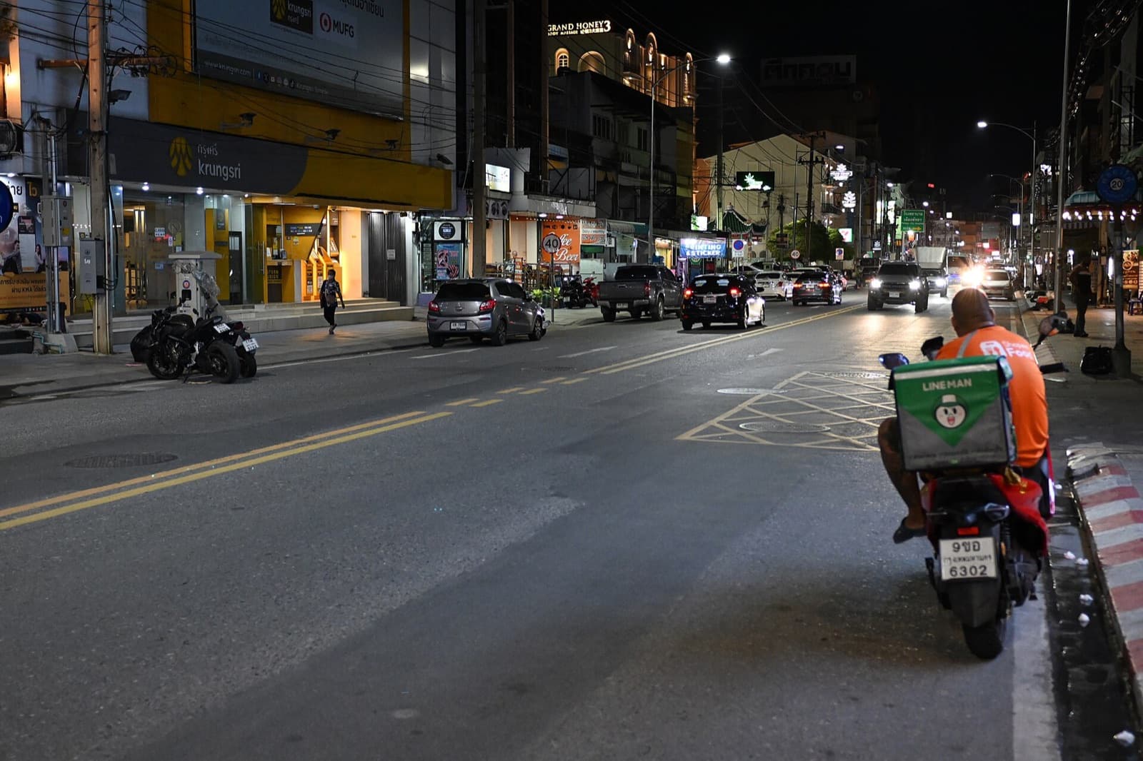 A courier moving through traffic on a delivery run
