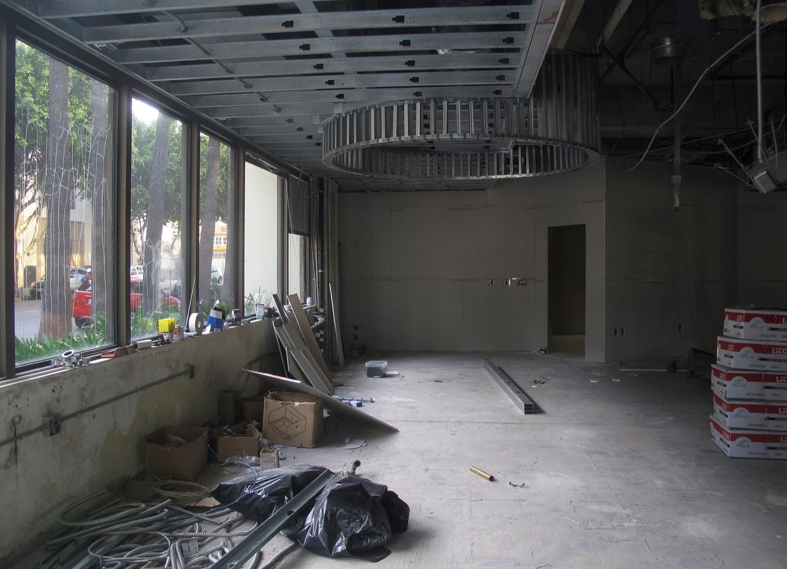 An untenanted commercial space mid-fit-out: the point where the budget gets rewritten