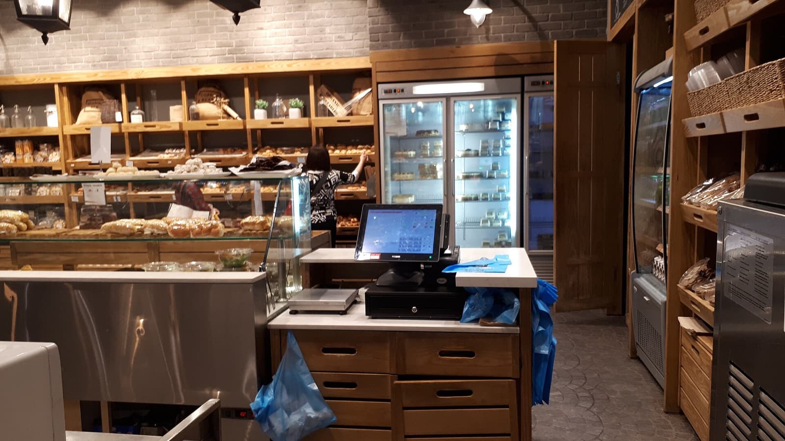 A touchscreen point of sale at a bakery counter