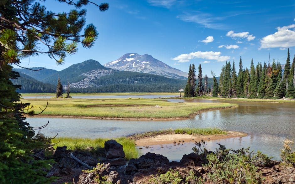Bend, Oregon with the Deschutes River cutting through the Old Mill District and the Cascades and Mt. Bachelor on the western horizon