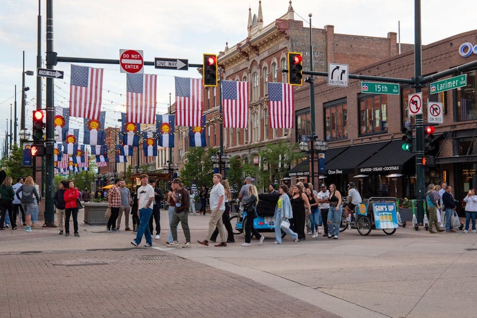 Centennial, Colorado streetscape near the Denver Tech Center with mid-rise corporate towers and the front range visible in the distance