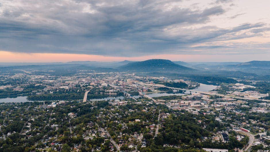 Chattanooga skyline with the Walnut Street Bridge crossing the Tennessee River at sunset, Lookout Mountain on the horizon