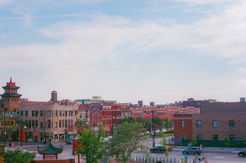 Downtown Joliet, Illinois, with the Rialto Square Theatre, the limestone Joliet Correctional Center walls, and the Des Plaines River corridor visible