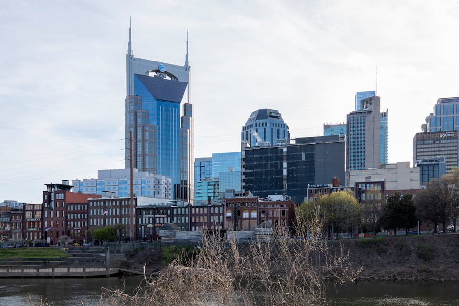 Nashville skyline at dusk, Lower Broadway neon over the Cumberland River