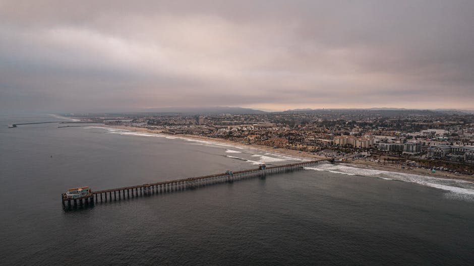 Oceanside Pier at dusk with the wooden deck stretching out over the Pacific