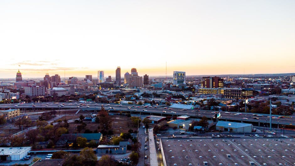 San Antonio skyline at dusk with the River Walk, the Tower of the Americas, and the historic Pearl Brewery district