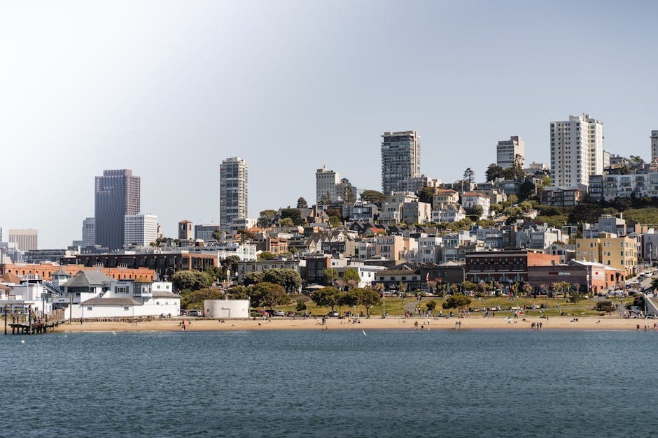 San Francisco skyline with the Golden Gate Bridge under low fog above the bay