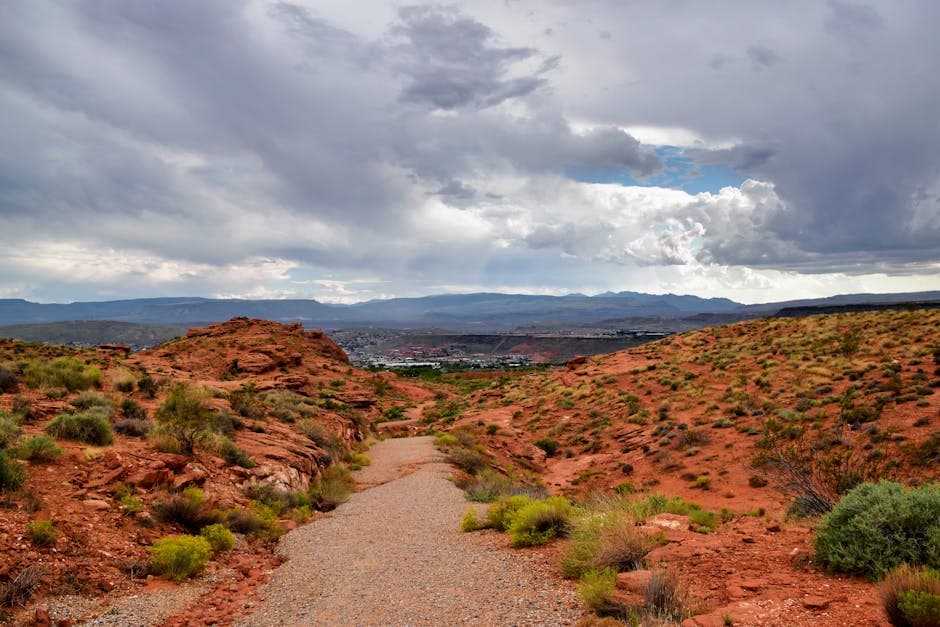 St. George, Utah, at the door of Zion National Park, with red rock cliffs framing the Mojave Desert valley and the I-15 corridor running south toward Las Vegas.