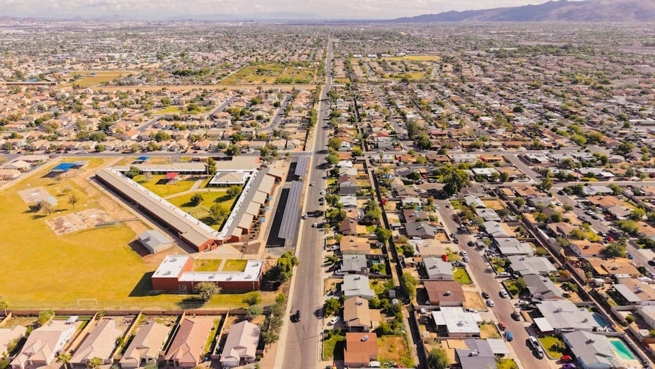 Surprise, Arizona, with the Surprise Stadium ballpark, the Tennis and Racquet Complex courts, and the Sun City Grand retiree community in the West Valley desert.