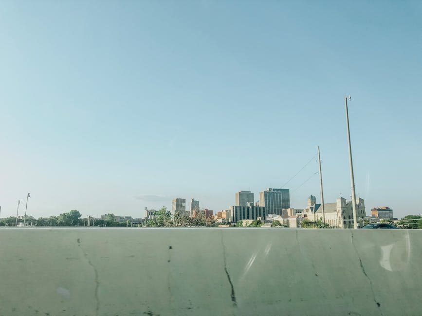 Toledo skyline on the Maumee River with the High Level Bridge, the Owens Corning headquarters tower, and the downtown Warehouse District