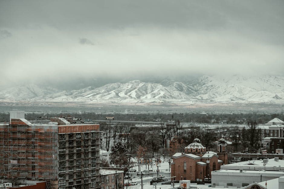 West Valley City on the floor of the Salt Lake Valley between the Wasatch and Oquirrh ranges, with the Maverik Center and the diverse restaurant corridor along 3500 South